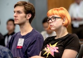 “Student Lotte Steenbrink listens to one of the ISOC briefing session speakers at IETF 87 in Berlin.”